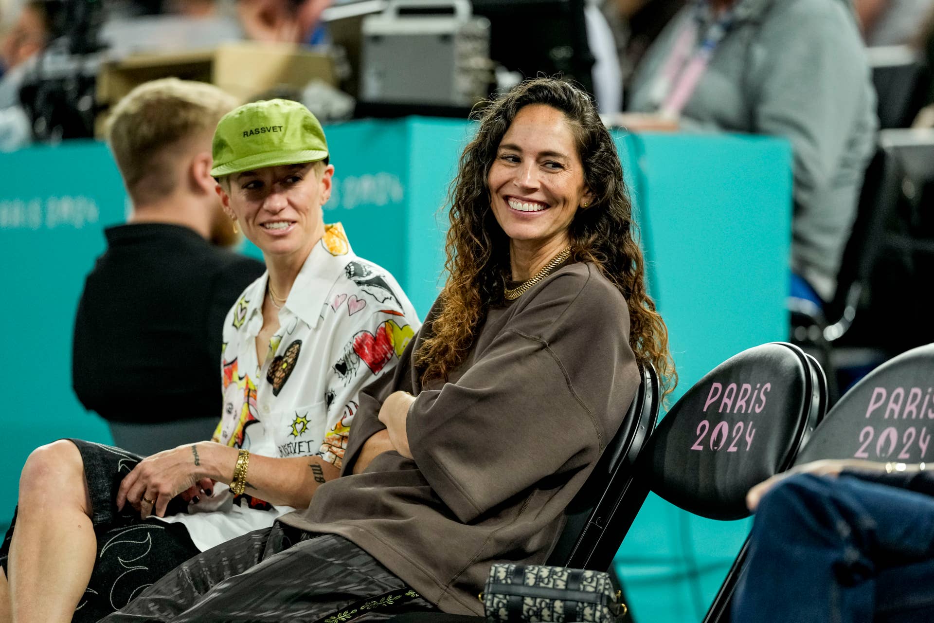 Sue Bird sitting courtside in Paris.