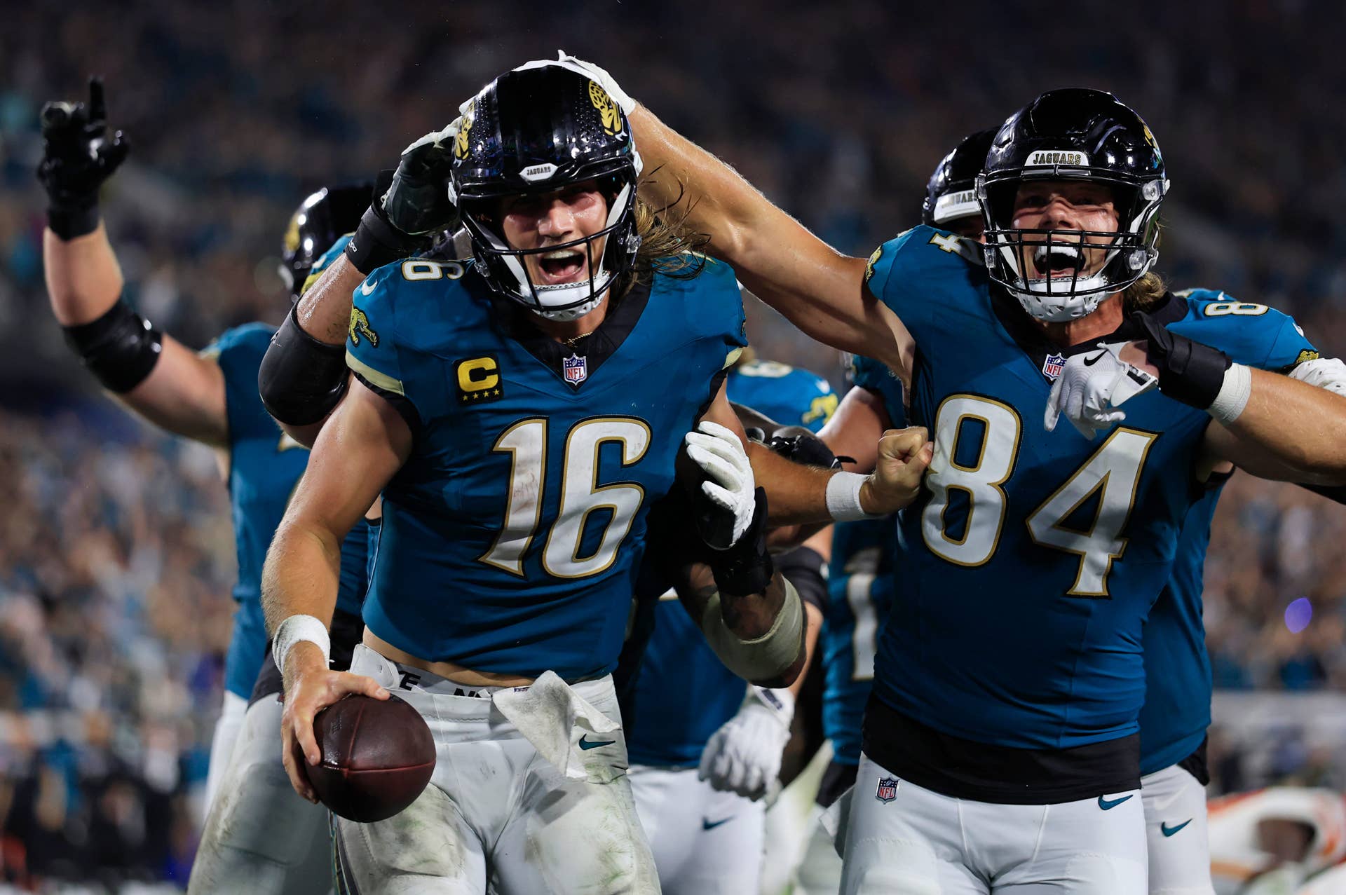 The Jaguars quarterback Trevor Lawrence (16) celebrates his game-winning touchdown.