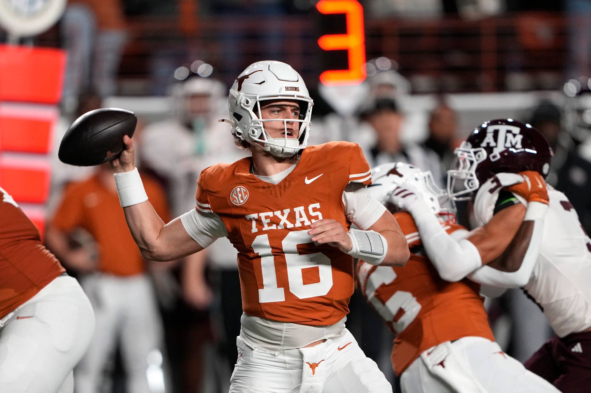 Texas Longhorns quarterback Arch Manning throws a pass against the Texas A&M Aggies