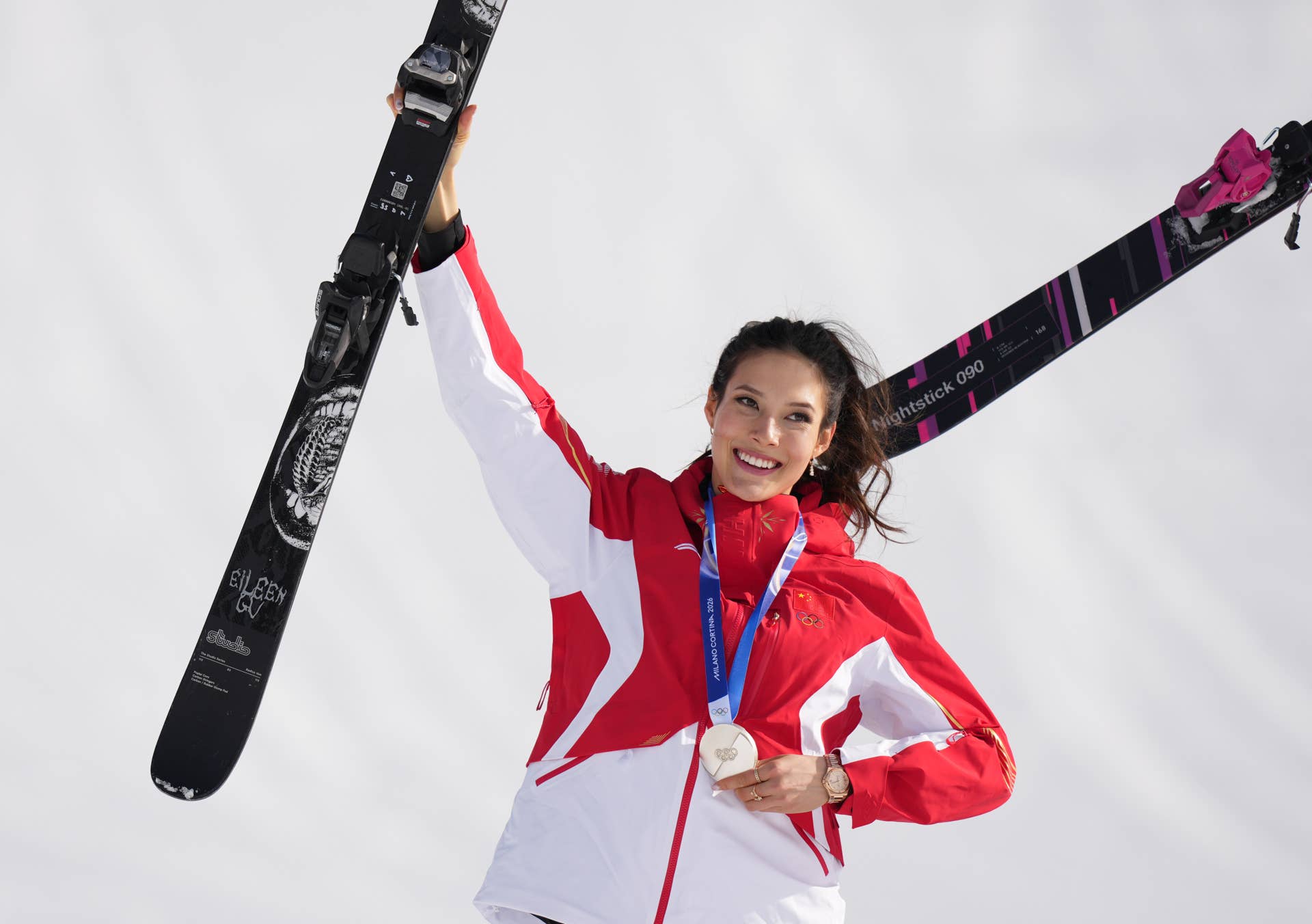China representative Eileen Gu celebrates with her silver medal in the 2026 Winter Olympics