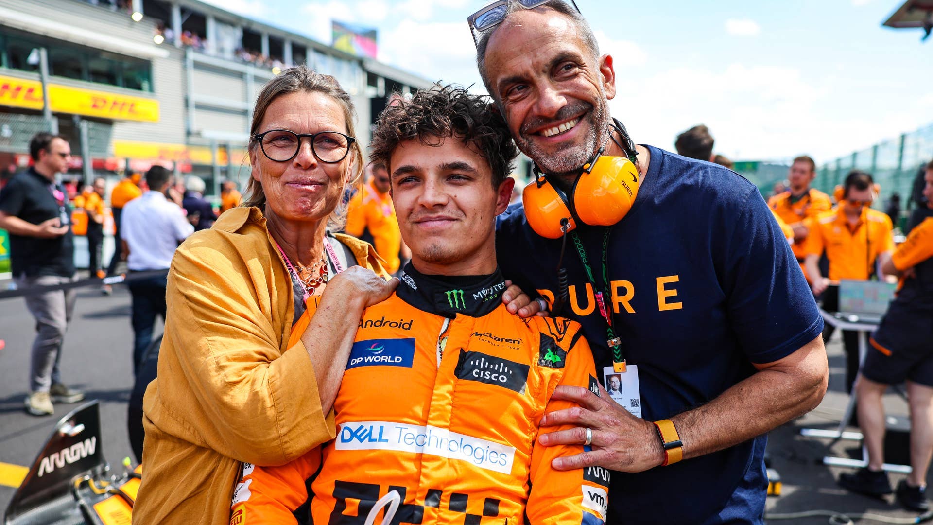 Lando Norris of Great Britain and McLaren with father Adam and mother Cisca pose on the grid during the F1 Grand Prix of Belgium at Circuit de Spa-Francorchamps.
