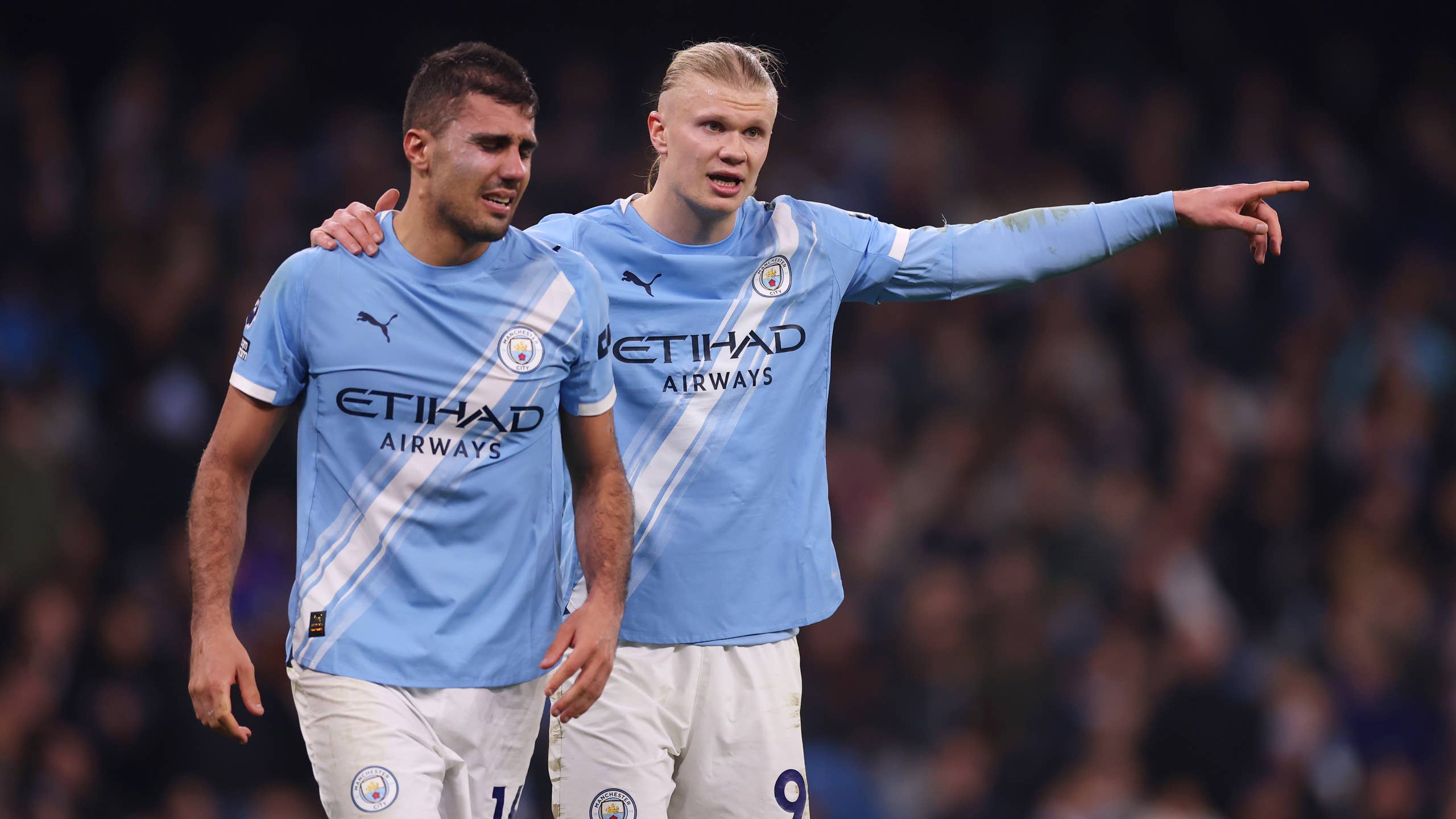 Erling Haaland of Manchester City interacts with teammate Rodri during the Premier League match between Manchester City and Nottingham Forest.