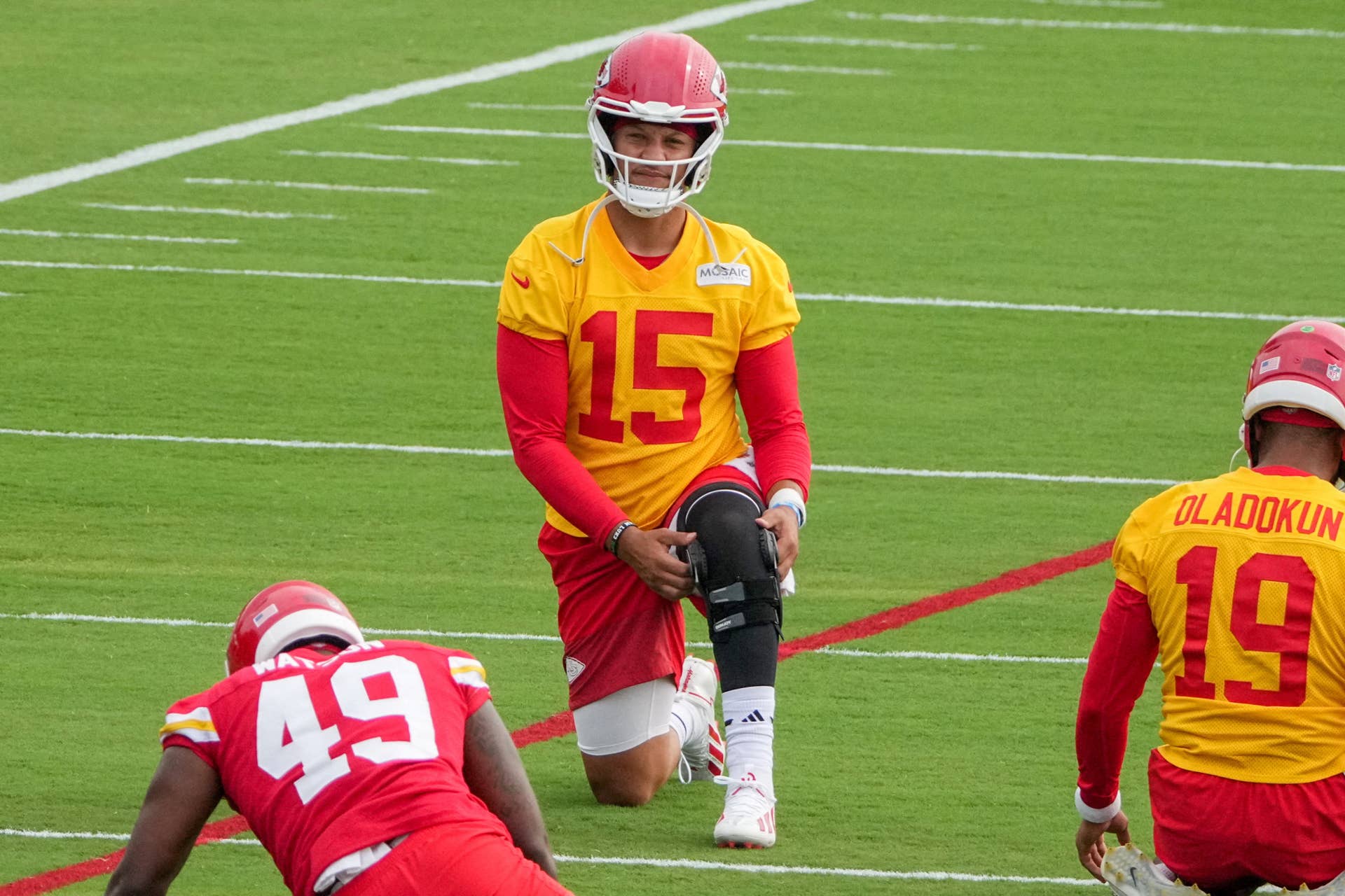 Patrick Mahomes stretching at Kansas City Chiefs training camp while returning from knee surgery