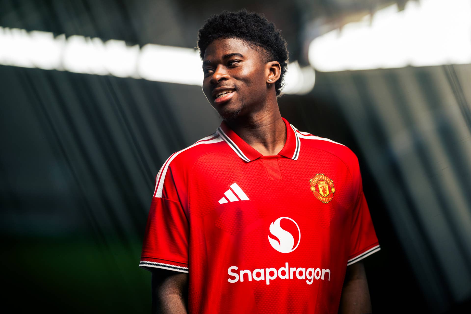 Carlos Baleba wearing Manchester United's 2026 home shirt