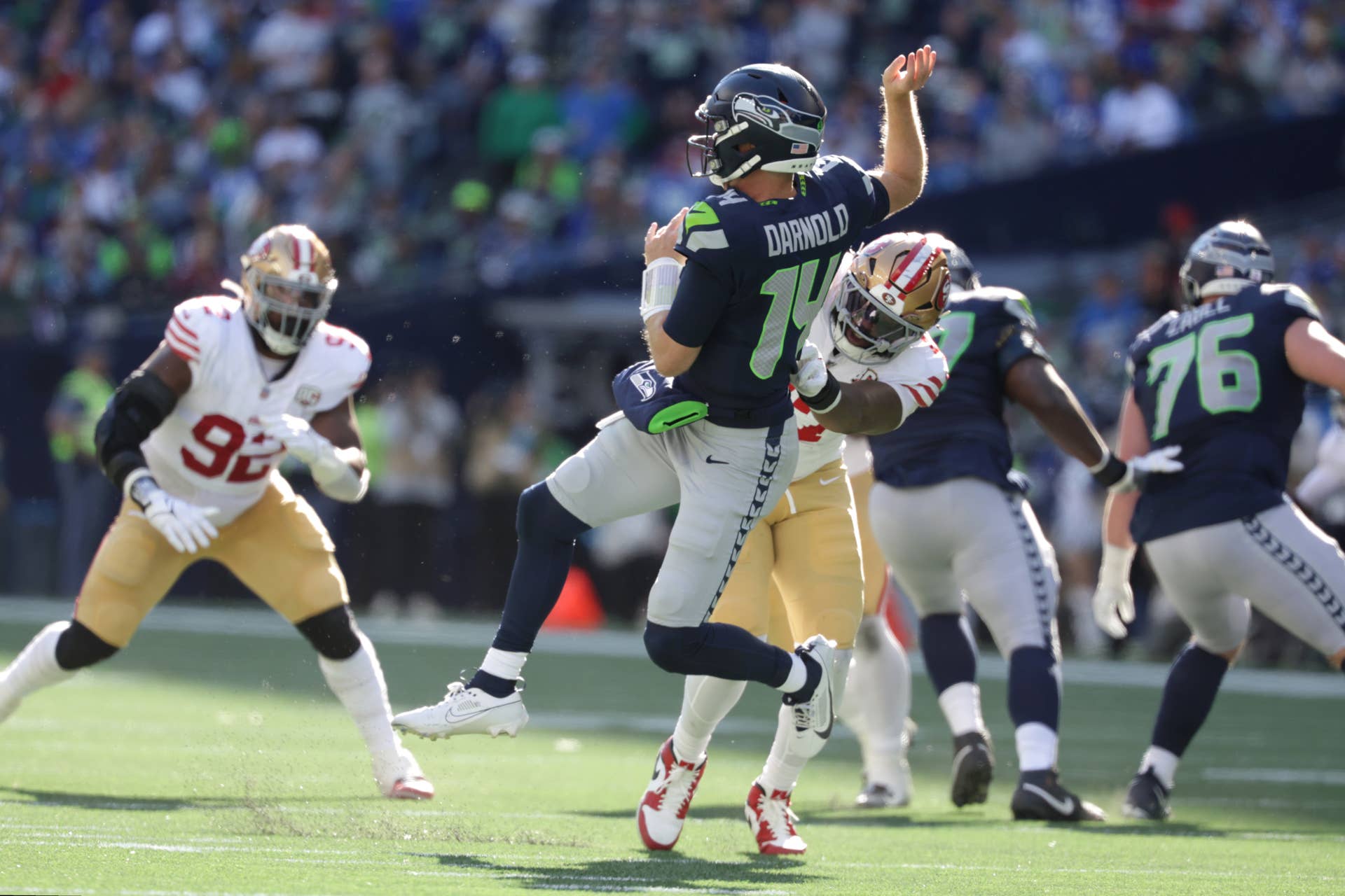 Oct 11, 2026; Seattle, Washington, USA; Seattle Seahawks quarterback Sam Darnold (14) is hit by San Francisco 49ers defensive end Khalid Kareem (47) after throwing a pass during the first half at Lumen Field. Mandatory Credit: Joe Nicholson-Imagn Images 