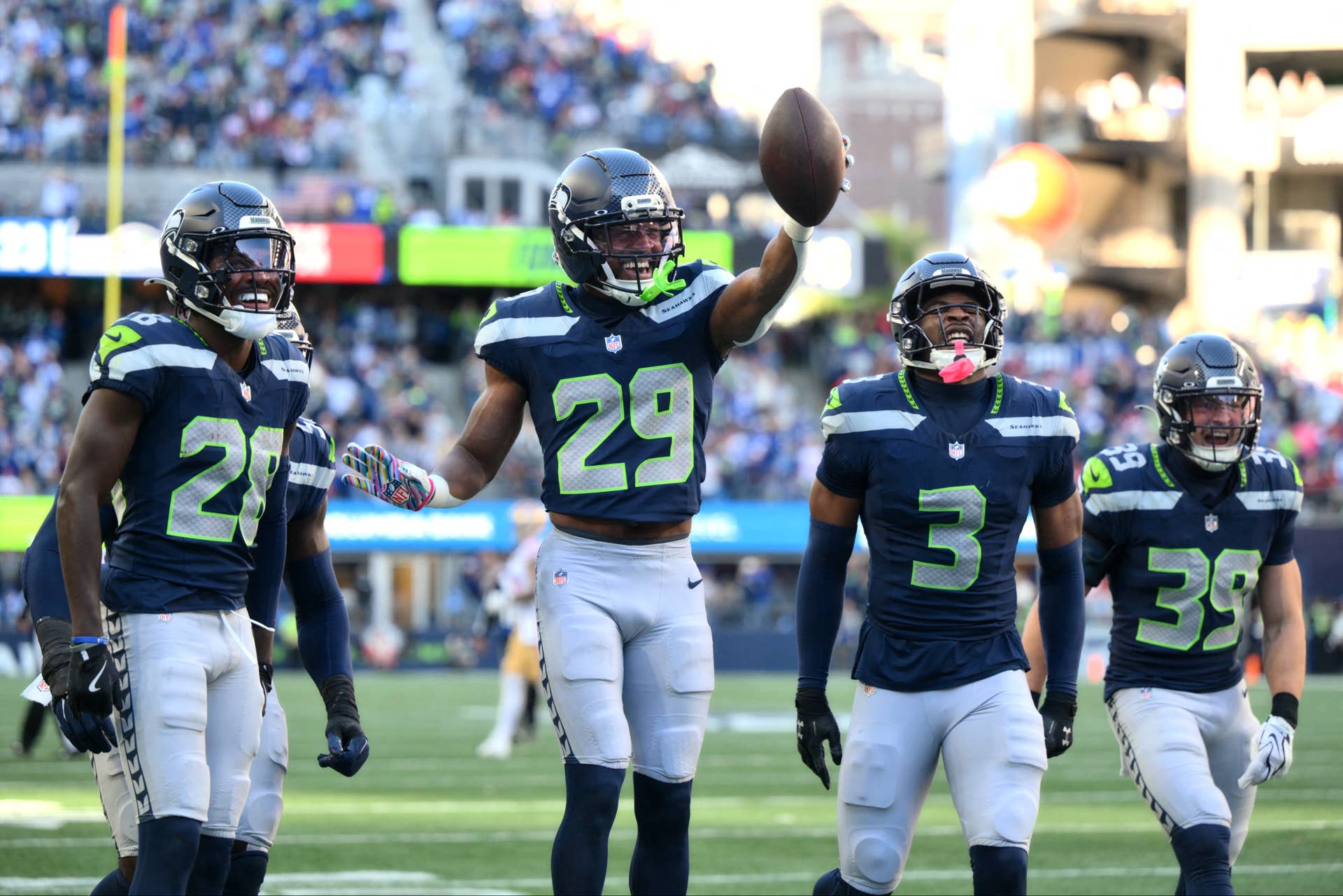 Oct 11, 2026; Seattle, Washington, USA; Seattle Seahawks cornerback Josh Jobe (29) celebrates with cornerback Nehemiah Pritchett (28), safety Nick Emmanwori (3) and safety Ty Okada (39) after recovering a fumble against the San Francisco 49ers during the third quarter at Lumen Field. Mandatory Credit: Steven Bisig-Imagn Images 