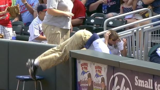 Twins' Ballboy Falls Into Crowd Spectacularly