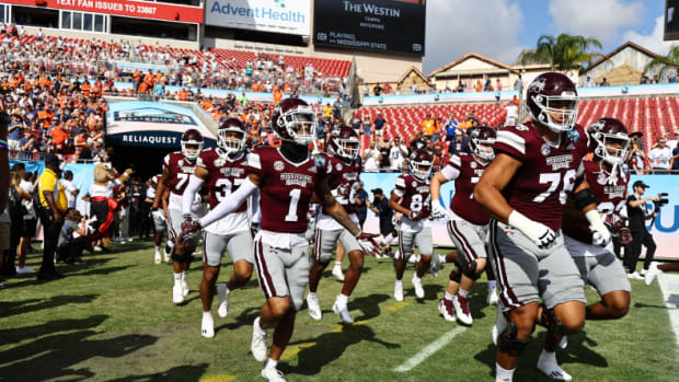 Mississippi State players jog onto the field ahead of the ReliaQuest Bowl