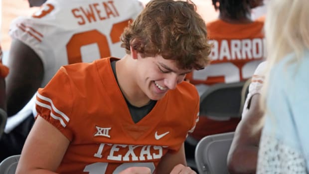 Apr 15, 2023; Austin, TX, USA; Texas Longhorns quarterback Arch Manning (16) signs autographs for fans before the Texas Spring Game at DKR- Texas Memorial Stadium. Mandatory Credit: Scott Wachter-USA TODAY Sports