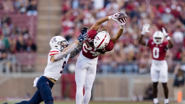 Sep 23, 2023; Stanford, California, USA; Arizona Wildcats safety Gunner Maldonado (9) defends as Stanford Cardinal wide receiver Tiger Bachmeier (24) catches a thirty-five yard pass during the third quarter at Stanford Stadium. Mandatory Credit: John Hefti-USA TODAY Sports