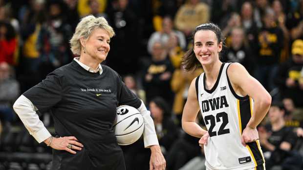 Feb 15, 2024; Iowa City, Iowa, USA; Iowa Hawkeyes guard Caitlin Clark (22) reacts with head coach Lisa Bluder after the game at Carver-Hawkeye Arena against the Michigan Wolverines. During the game Clark would break the NCAA women's all-time scoring record. Mandatory Credit: Jeffrey Becker-USA TODAY Sports