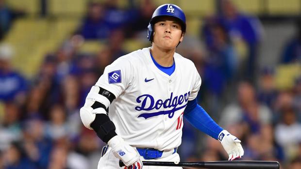 Los Angeles Dodgers designated hitter Shohei Ohtani (17) reacts after striking out against the San Francisco Giants during the first inning at Dodger Stadium.