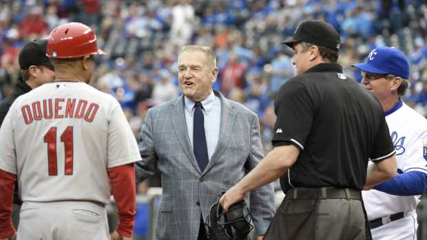 Former St. Louis Cardinals and Kansas City Royals manager Whitey Herzog meets with coaches from both teams during a 2015 game.
