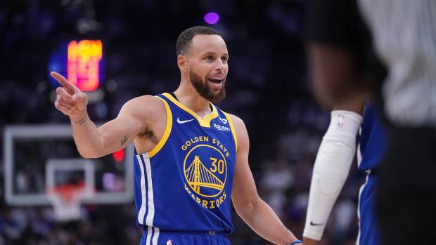 Apr 16, 2024; Sacramento, California, USA; Golden State Warriors guard Stephen Curry (30) talks with teammates after a play against the Sacramento Kings in the second quarter during a play-in game of the 2024 NBA playoffs at the Golden 1 Center.