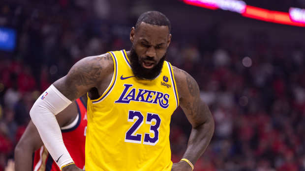 Apr 16, 2024; New Orleans, Louisiana, USA; Los Angeles Lakers forward LeBron James (23) reacts during the first half against the New Orleans Pelicans in a play-in game of the 2024 NBA playoffs against the New Orleans Pelicans at Smoothie King Center.