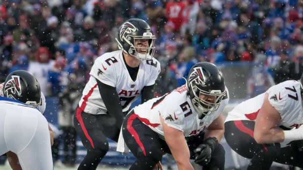 Atlanta Falcons quarterback Matt Ryan (2) and center Matt Hennessy (61) at the line of scrimmage in the fourth quarter against the Buffalo Bills at Highmark Stadium. 