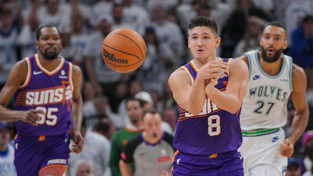 Apr 23, 2024; Minneapolis, Minnesota, USA; Phoenix Suns guard Grayson Allen (8) passes against the Minnesota Timberwolves in the second quarter during game two of the first round for the 2024 NBA playoffs at Target Center.