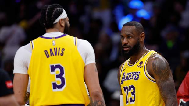 Apr 3, 2024; Washington, District of Columbia, USA; Los Angeles Lakers forward LeBron James (23) talks with Lakers forward Anthony Davis (3) against the Washington Wizards at Capital One Arena.