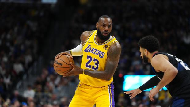 Los Angeles Lakers forward LeBron James (23) and Denver Nuggets guard Jamal Murray (27) in the first quarter during game two of the first round for the 2024 NBA playoffs at Ball Arena. 
