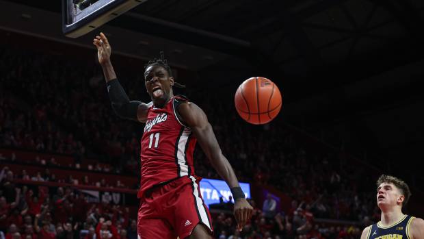 Feb 29, 2024; Piscataway, New Jersey, USA; Rutgers Scarlet Knights center Clifford Omoruyi (11) reacts after a dunk during the second half against the Michigan Wolverines at Jersey Mike's Arena.