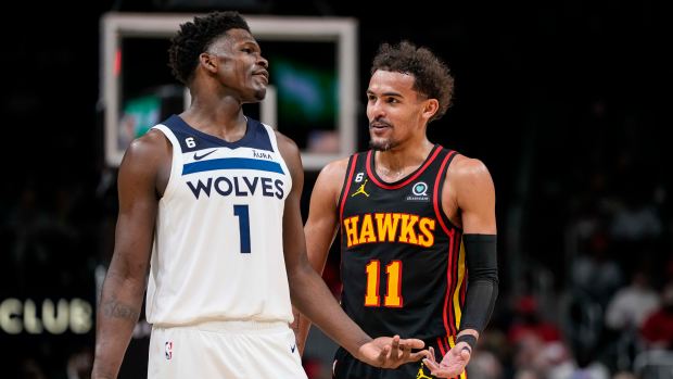 Mar 13, 2023; Atlanta, Georgia, USA; Minnesota Timberwolves guard Anthony Edwards (1) reacts with Atlanta Hawks guard Trae Young (11) during the second half at State Farm Arena.
