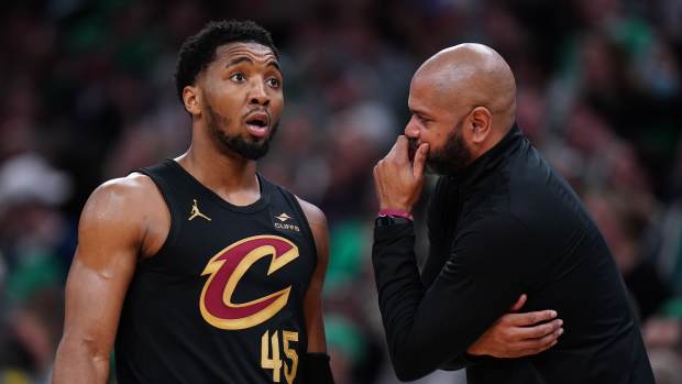 Donovan Mitchell of the Cavaliers with head coach JB Bickerstaff.