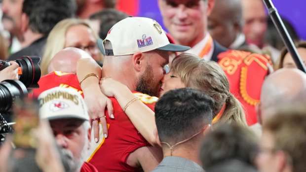 Feb 11, 2024; Paradise, Nevada, USA; Kansas City Chiefs tight end Travis Kelce (87) kisses Recording artist Taylor Swift after winning Super Bowl LVIII against the San Francisco 49ers at Allegiant Stadium.