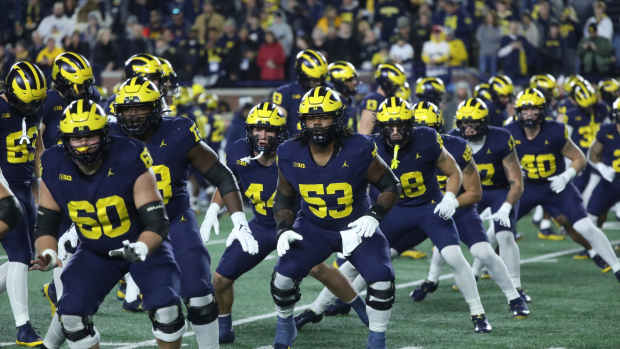 Michigan Wolverines offensive lineman Trente Jones (53) and the team warm up before action against the Purdue Boilermakers at Michigan Stadium, Saturday, Nov. 4, 2023.
