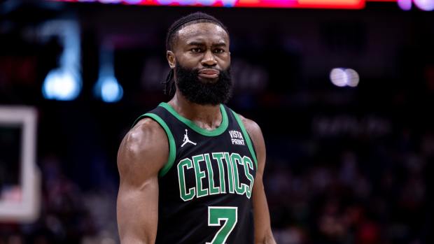 Mar 30, 2024; New Orleans, Louisiana, USA; Boston Celtics guard Jaylen Brown (7) has a few words with the team attendant after he slips on the court against the New Orleans Pelicans during the first half at Smoothie King Center.