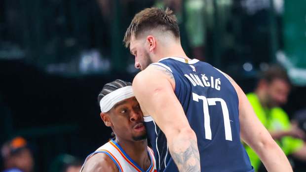 May 11, 2024; Dallas, Texas, USA; Oklahoma City Thunder guard Shai Gilgeous-Alexander (2) runs into Dallas Mavericks guard Luka Doncic (77) during the first half during game three of the second round for the 2024 NBA playoffs at American Airlines Center.