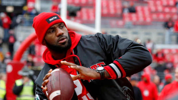 Nov 26, 2016; Columbus, OH, USA; Cleveland Cavaliers player LeBron James plays catch with the Ohio State Buckeyes team before the game against the Michigan Wolverines at Ohio Stadium. Mandatory Credit: Joe Maiorana-USA TODAY Sports  
