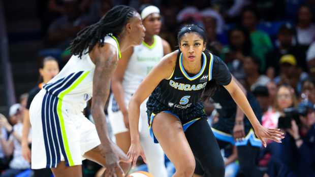 Dallas Wings forward Natasha Howard (6) dribbles as Chicago Sky forward Angel Reese (5) defends during the second half at College Park Center.