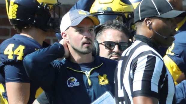 Former Michigan football staffer Connor Stalions on the sideline during a game.