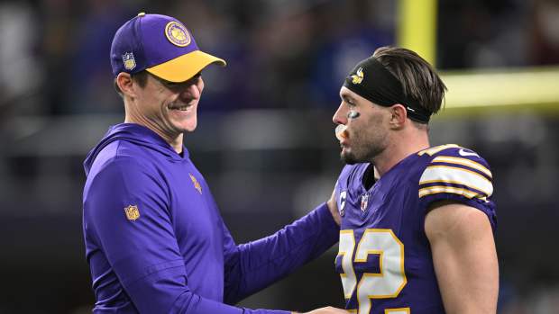 Nov 27, 2023; Minneapolis, Minnesota, USA; Minnesota Vikings head coach Kevin O'Connell greets safety Harrison Smith (22) before the game between the Minnesota Vikings and the Chicago Bears at U.S. Bank Stadium.