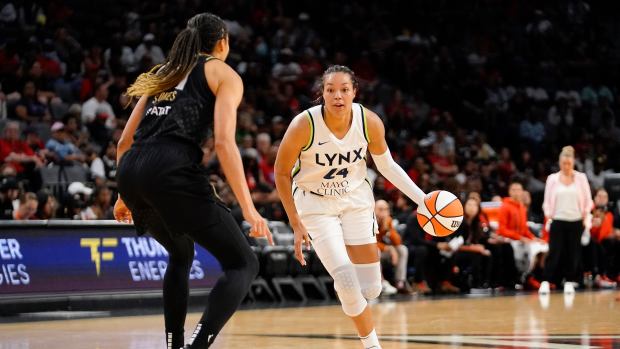 May 28, 2023; Las Vegas, Nevada, USA; Minnesota Lynx forward Napheesa Collier (24) dribbles the ball against Las Vegas Aces center Kiah Stokes (41) during the second quarter at Michelob Ultra Arena. Mandatory Credit: Lucas Peltier-USA TODAY Sports  