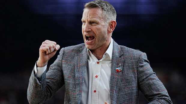 Alabama head coach Nate Oats celebrates a play against Connecticut during the Final Four semifinal game at State Farm Stadium.