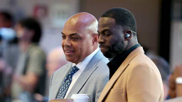 May 26, 2024; Dallas, Texas, USA; Charles Barkley (left) and Draymond Green (right) look on in the first half between the Dallas Mavericks and the Minnesota Timberwolves during game three of the western conference finals for the 2024 NBA playoffs at American Airlines Center. Mandatory Credit: Kevin Jairaj-USA TODAY Sports