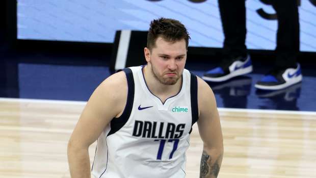 May 30, 2024; Minneapolis, Minnesota, USA; Dallas Mavericks guard Luka Doncic (77) reacts after a play during the second quarter in game five of the western conference finals for the 2024 NBA playoffs against the Minnesota Timberwolves at Target Center. Mandatory Credit: Jesse Johnson-USA TODAY Sports  