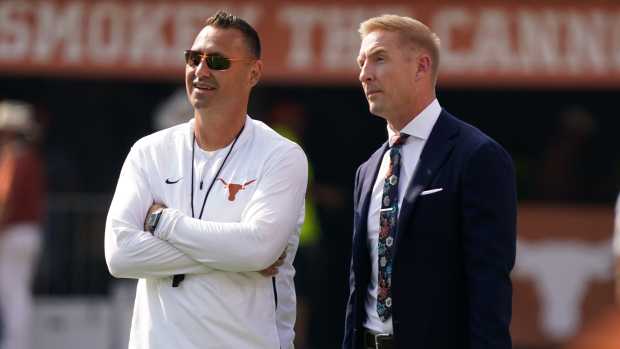 Sep 10, 2022; Austin, Texas, USA; Texas Longhorns head coach Steve Sarkisian talks with Fox Sports analyst Joel Klatt before the game against the Alabama Crimson Tide at Darrell K Royal-Texas Memorial Stadium.