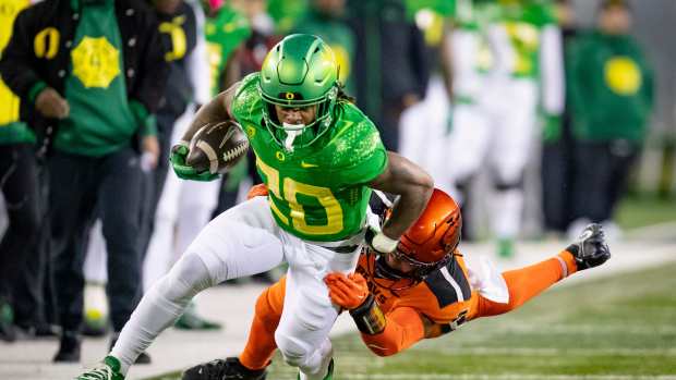 Oregon running back Jordan James carries the ball as the No. 6 Oregon Ducks take on the No. 16 Oregon State Beavers Friday, Nov. 24, 2023, at Autzen Stadium in Eugene, Ore.  