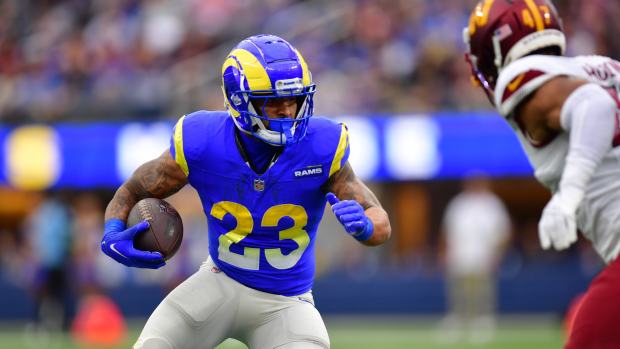 Dec 17, 2023; Inglewood, California, USA; Los Angeles Rams running back Kyren Williams (23) runs the ball against Washington Commanders linebacker Khaleke Hudson (47) during the first half at SoFi Stadium.