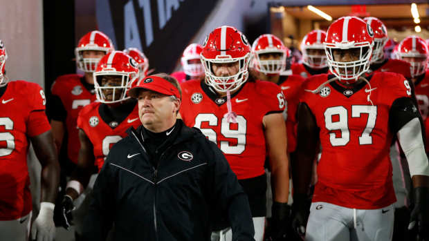 Georgia coach Kirby Smart lead the team onto the field to warm up before the start of a NCAA college football game against Ole Miss in Athens, Ga., on Saturday, Nov. 11, 2023