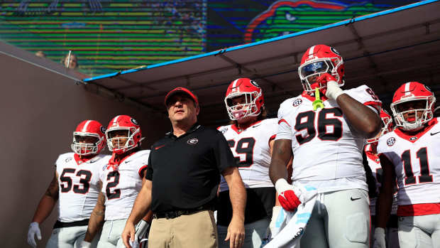 Georgia Bulldogs head coach Kirby Smart, center, prepares to lead, from left, offensive lineman Dylan Fairchild (53), running back Kendall Milton (2), offensive lineman Tate Ratledge (69), defensive lineman Zion Logue (96), and linebacker Jalon Walker (11) onto the field before an NCAA football game Saturday, Oct. 28, 2023 at EverBank Stadium in Jacksonville, Fla. Georgia defeated Florida 43-20.