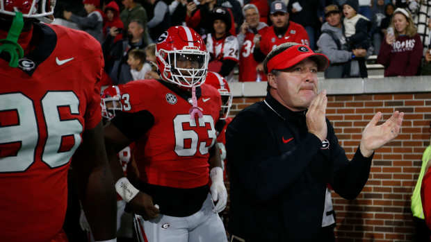 Georgia coach Kirby Smart leads his team onto the field for warm ups before the start of a NCAA college football game against Georgia Tech in Atlanta, on Saturday, Nov. 25, 2023.