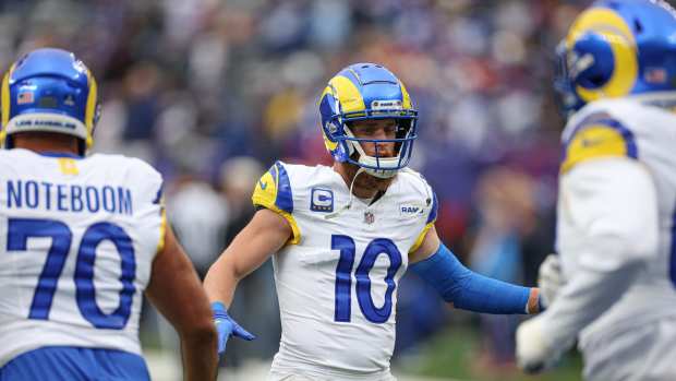 Dec 31, 2023; East Rutherford, New Jersey, USA; Los Angeles Rams wide receiver Cooper Kupp (10) greets offensive tackle Joe Noteboom (70) and teammates running onto the field before the game against the New York Giants at MetLife Stadium.