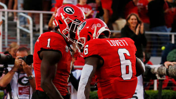 Georgia wide receiver Marcus Rosemy-Jacksaint (1) celebrates with Georgia wide receiver Dominic Lovett (6) after scoring a touchdown during the first half of a NCAA college football game against Kentucky in Athens, Ga., on Saturday, Oct. 7, 2023.