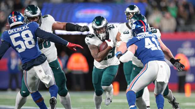 Philadelphia Eagles running back Rashaad Penny (23) carries the ball as New York Giants linebacker Micah McFadden (41) and linebacker Bobby Okereke (58) pursue during the second half at MetLife Stadium.