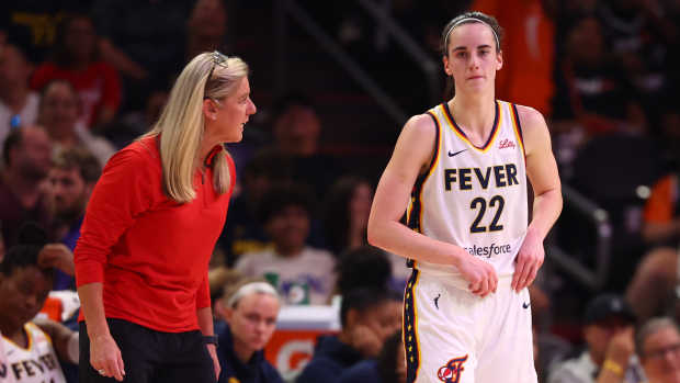 Indiana Fever head coach Christie Sides with guard Caitlin Clark (22)