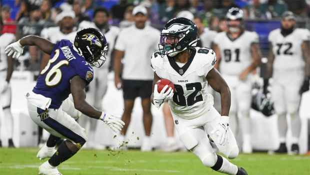 Aug 9, 2024; Baltimore, Maryland, USA; Philadelphia Eagles wide receiver Ainias Smith (82) returns a punt as Baltimore Ravens running back Owen Wright (36) defends during the second half of a preseason game at M&T Bank Stadium. Mandatory Credit: Tommy Gilligan-USA TODAY Sports