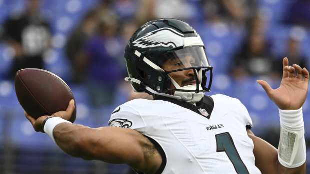 Philadelphia Eagles quarterback Jalen Hurts (1) throws before a preseason game against the Baltimore Ravens.